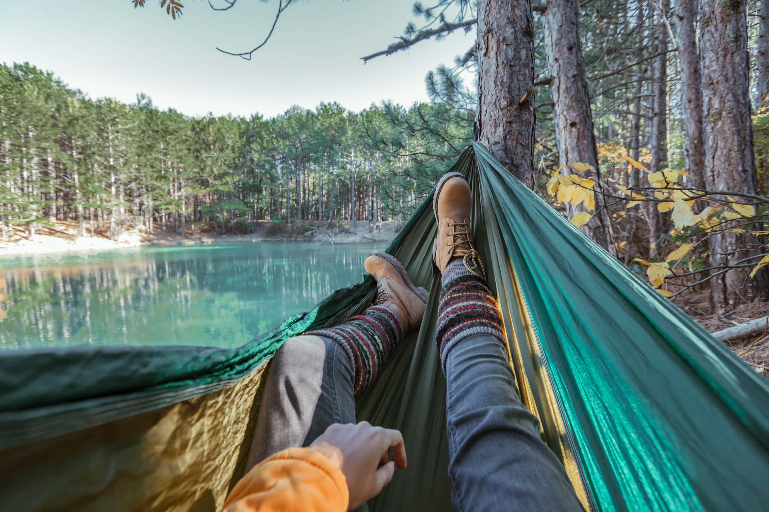 a first person view of a hiker in a hammock
