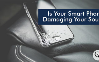 a phone on a car seat with a broken screen labeled is your smart phone damaging your soul?