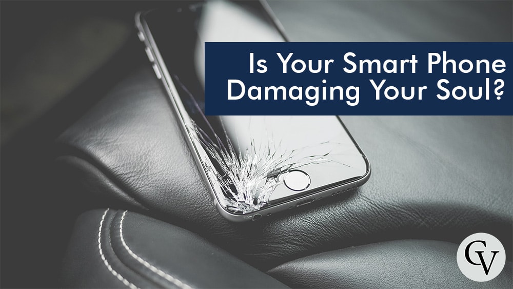 a phone on a car seat with a broken screen labeled is your smart phone damaging your soul?