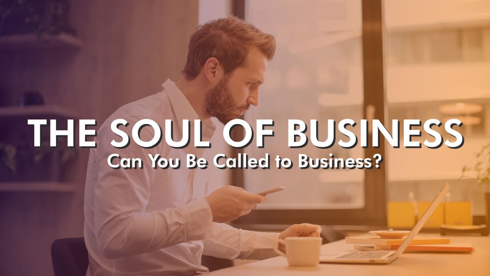 a man working at a laptop labeled the soul of business can you be called to business?